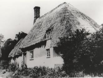 Cottage in The Row destroyed by fire 1960s, now the site of a bungalow